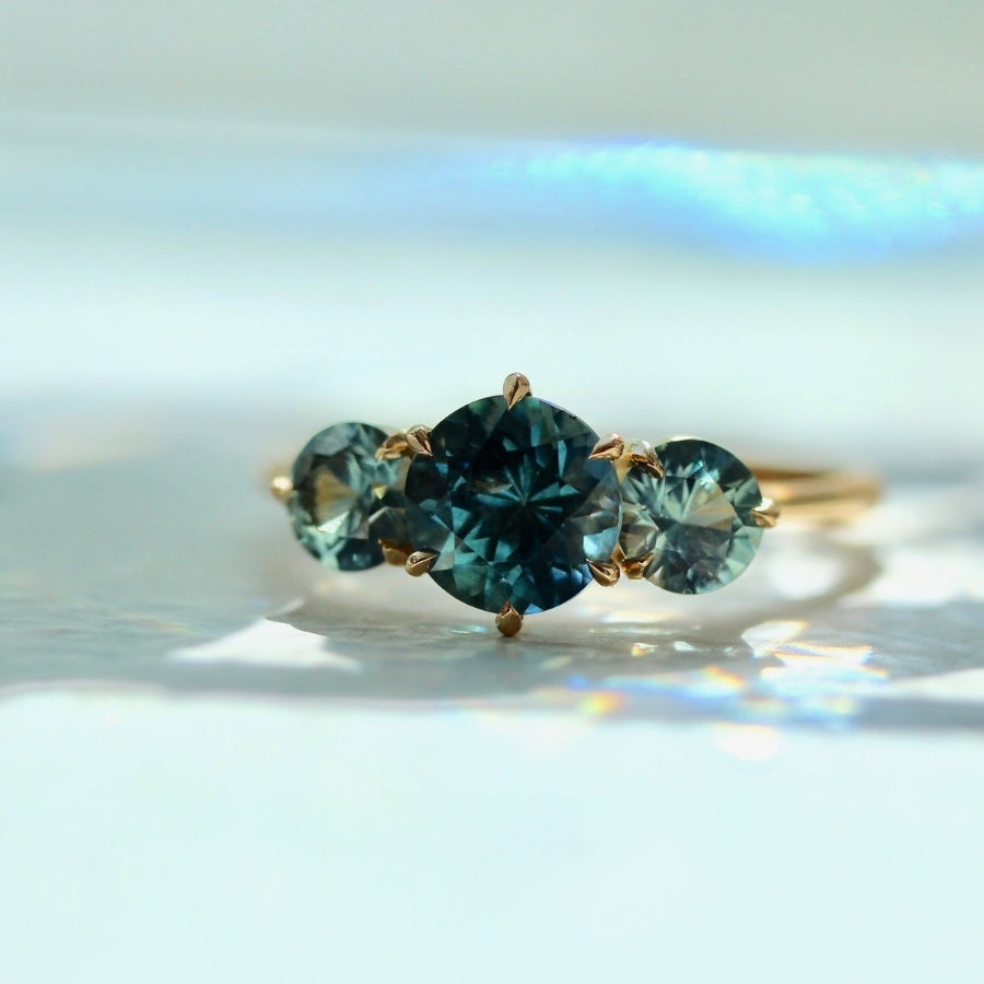 
            Sea Witch Teal Round Brilliant Cut Montana Sapphire Ring