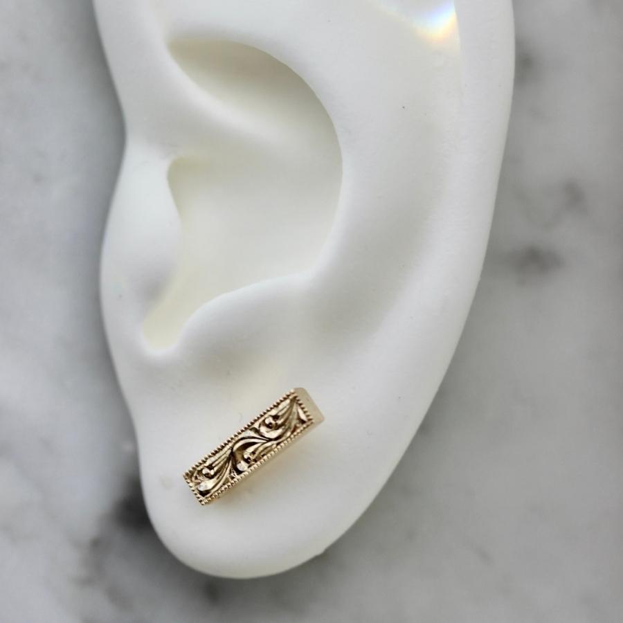 
            Charmed Engraved Gold Studs