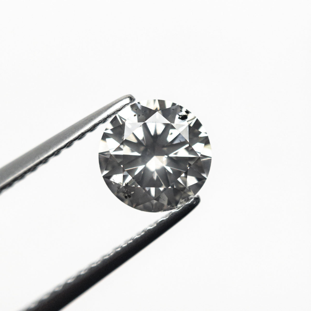 
            1.06ct 6.53x6.50x3.97mm SI2 Fancy Grey Round Brilliant 18462-01