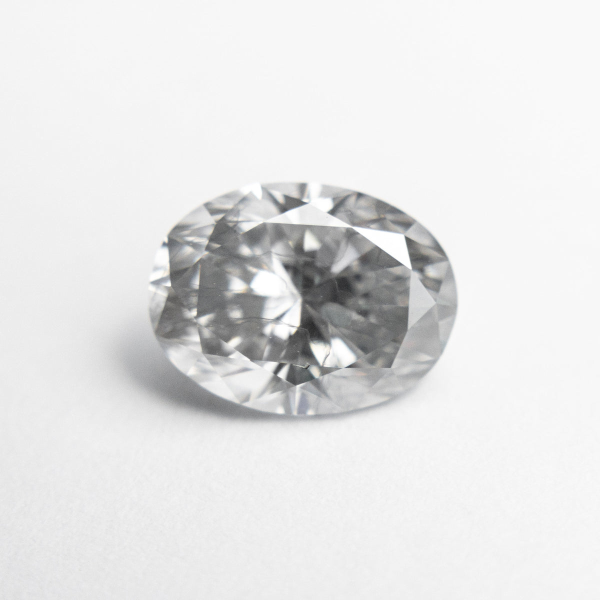 
            2.04ct 9.31x7.00x4.66mm GIA Fancy Light Grey Oval Brilliant 18981-01 - Misfit Diamonds