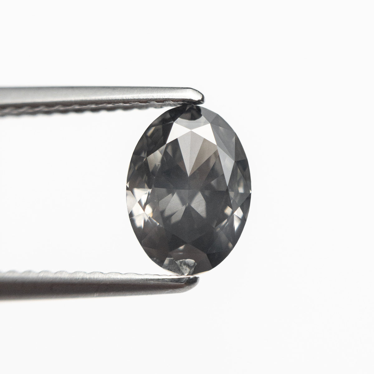 
            1.55ct 8.56x6.22x3.78mm GIA I1 Fancy Gray Oval Brilliant 19266-01 - Misfit Diamonds