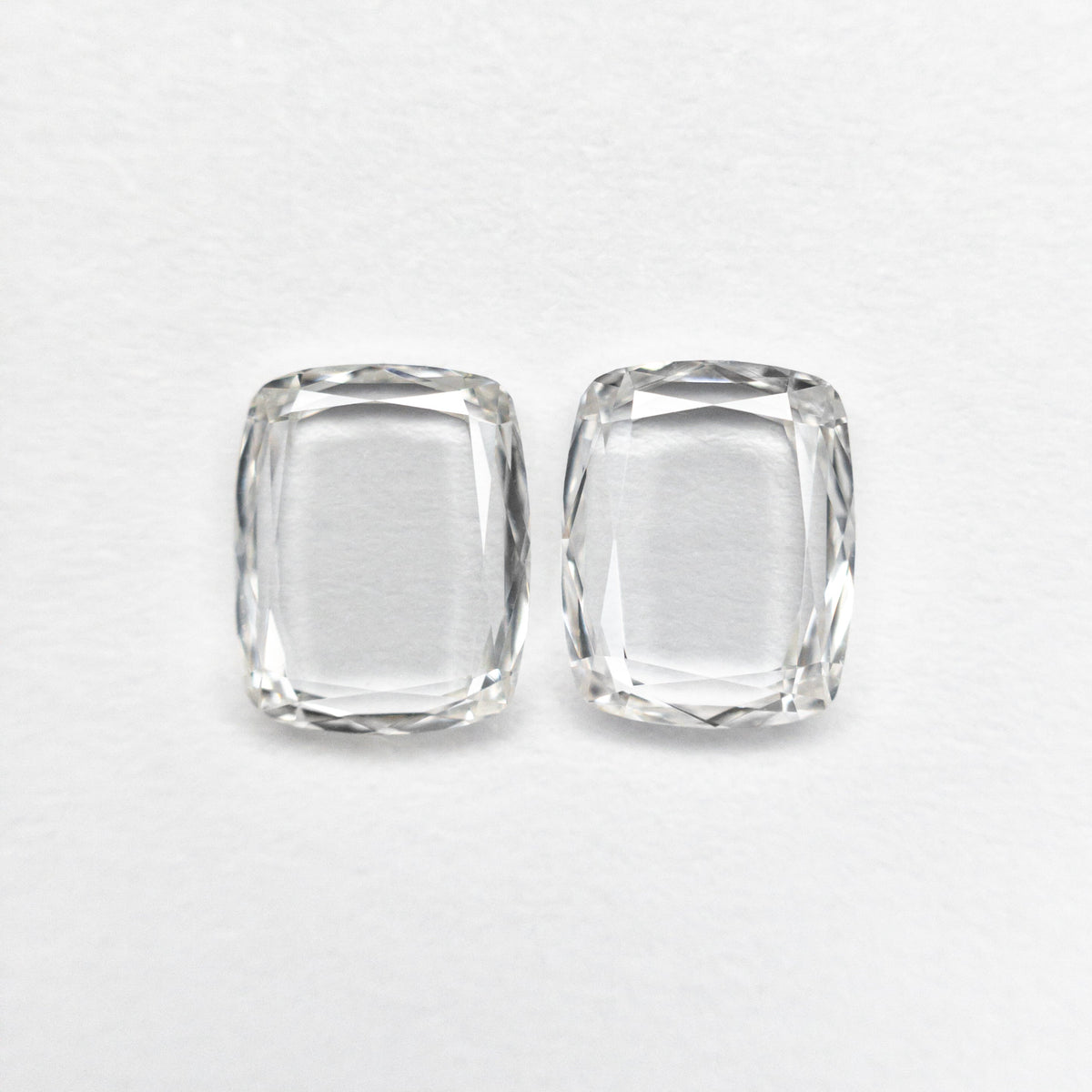 
            0.98cttw 2pc 6.06x4.85x1.21mm 6.00x4.81x1.36mm VS E-F Cushion Portrait Cut Matching Pair 19854-52