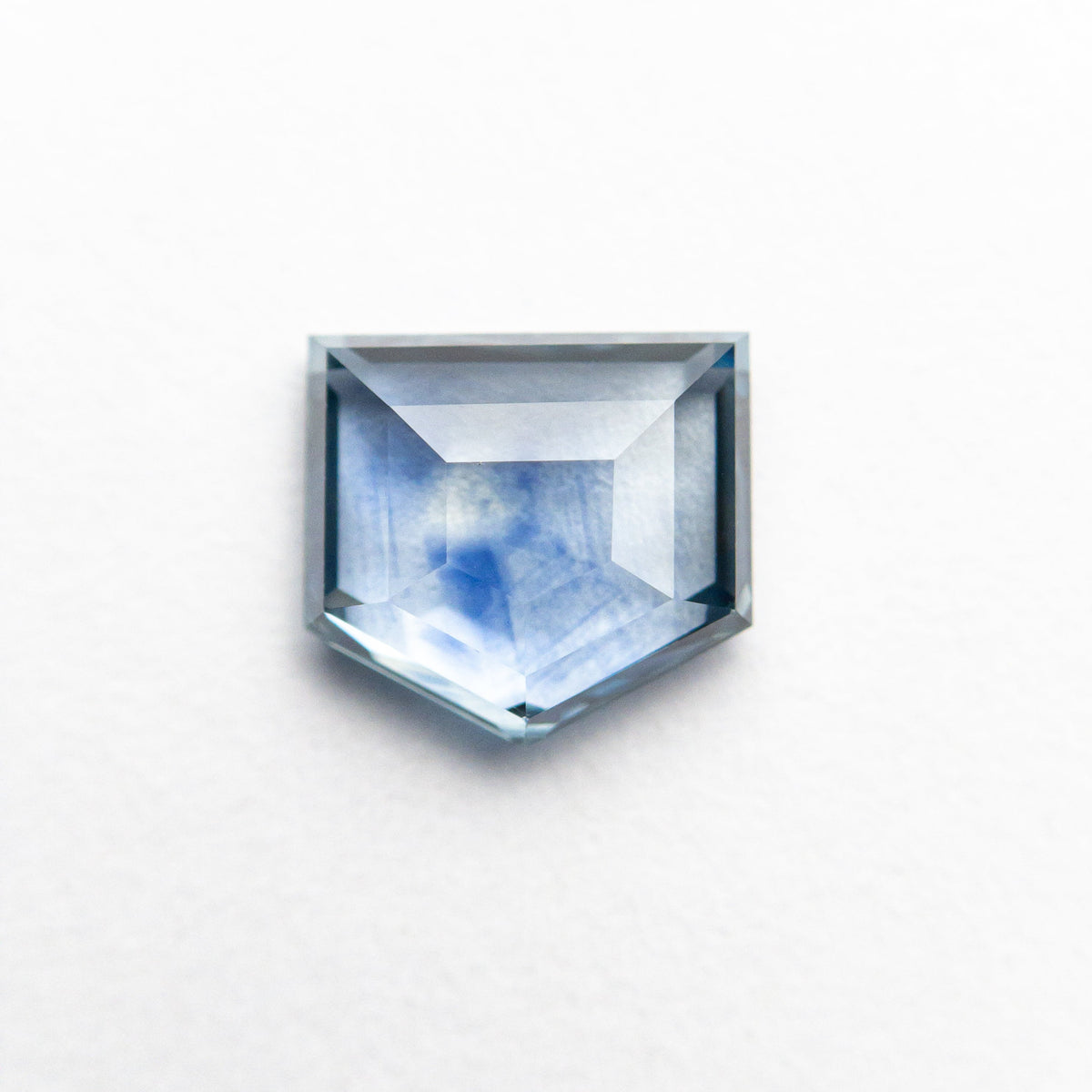 
            1.36ct 6.70x6.20x2.68mm Shield Rosecut Sapphire 21603-03