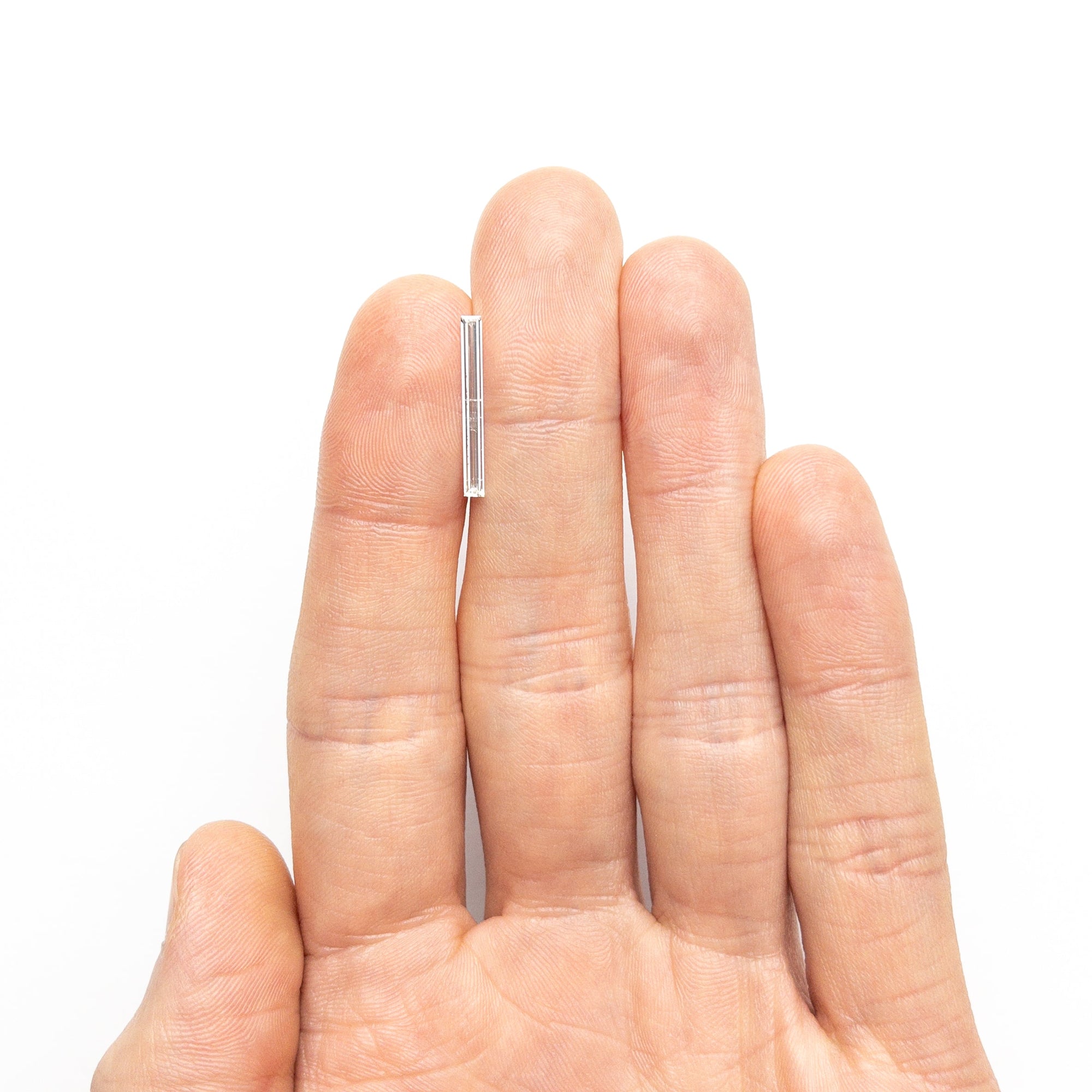 0.52ct 19.44x2.17x1.09mm SI2 E Baguette Step Cut 26545-01