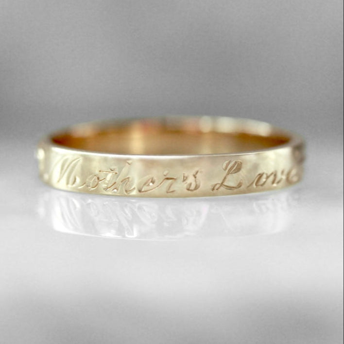 14k yellow gold band hand-engraved with ‘Mother’s Love’ – a sentimental custom heirloom by Gem Breakfast