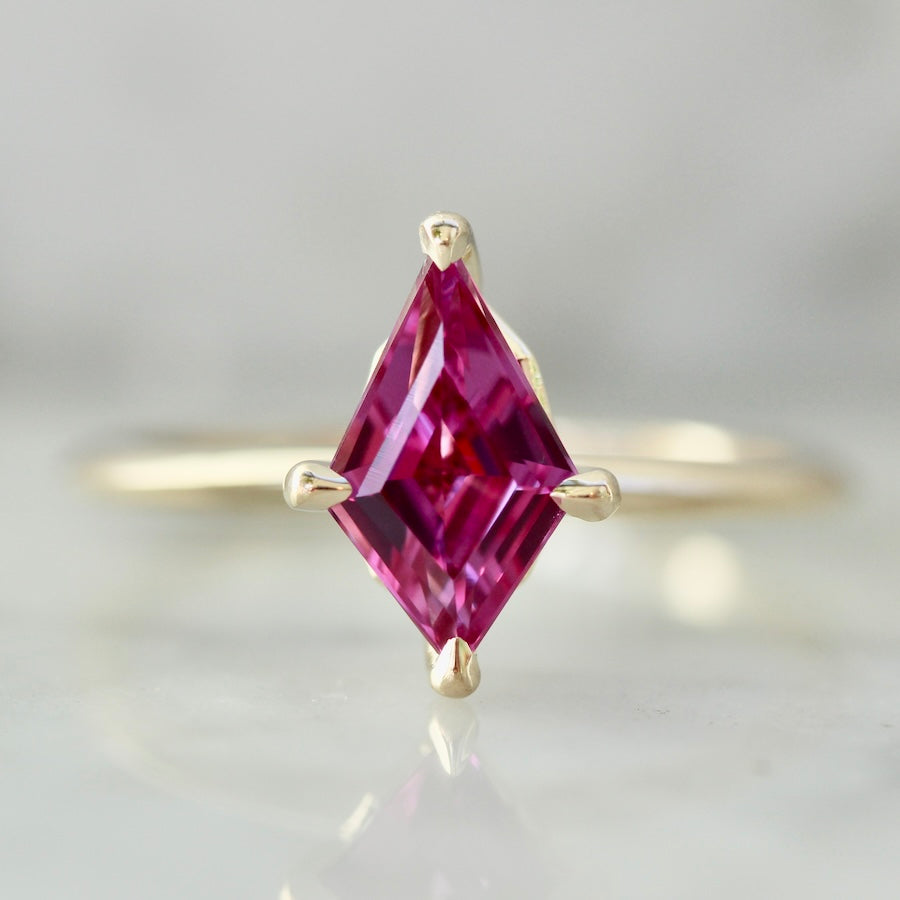 Custom engagement ring with kite cut hot pink sapphire in 14k yellow gold by Gem Breakfast