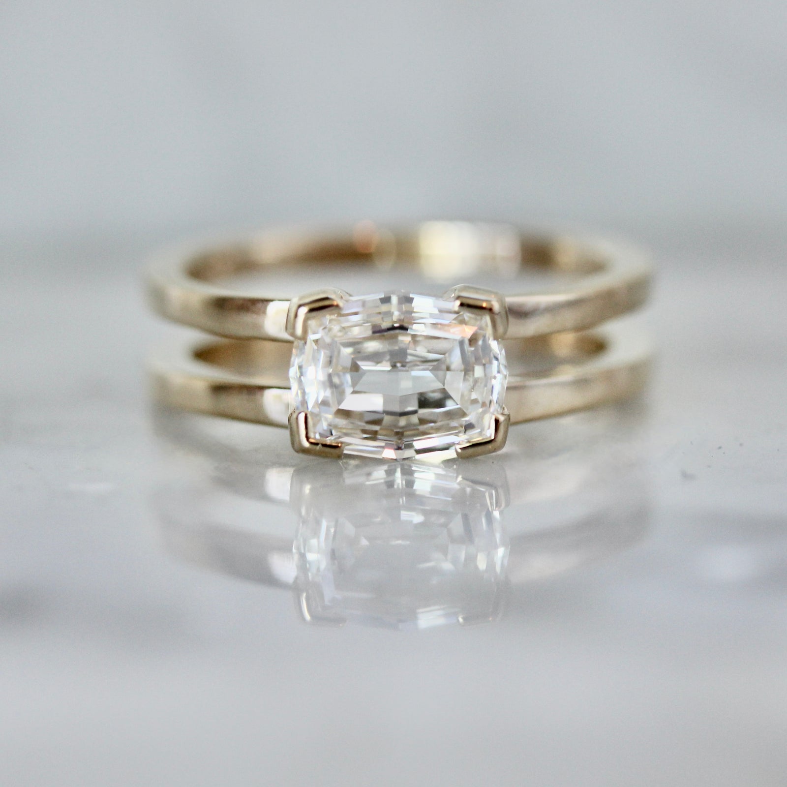 Split shank custom engagement ring with geometric cushion diamond in white gold by Gem Breakfast