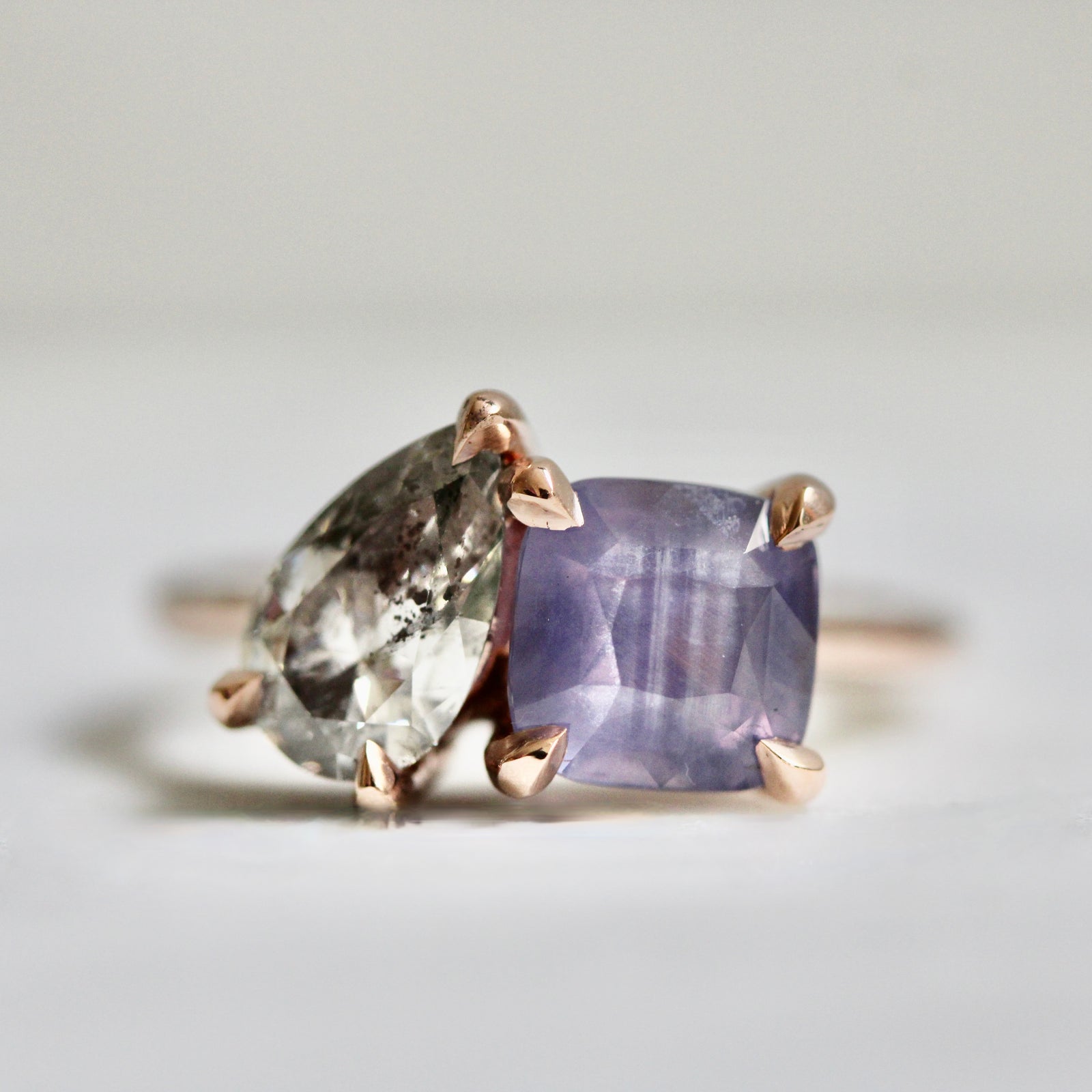 Custom Toi et Moi engagement ring with cushion cut purple sapphire and pear salt and pepper diamond by Gem Breakfast