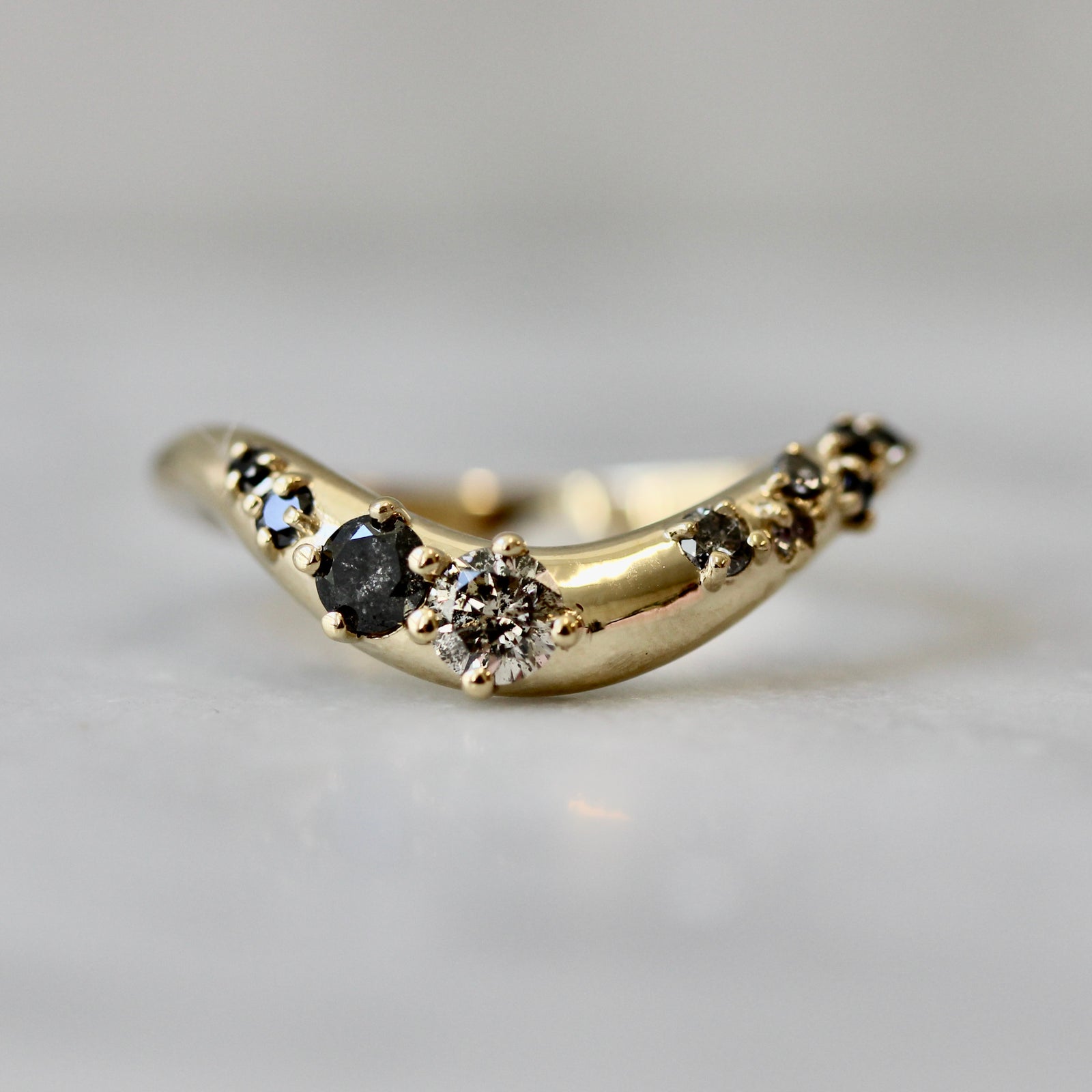 Salt and pepper diamond curved wedding band in thick 14k yellow gold, custom made by Gem Breakfast 