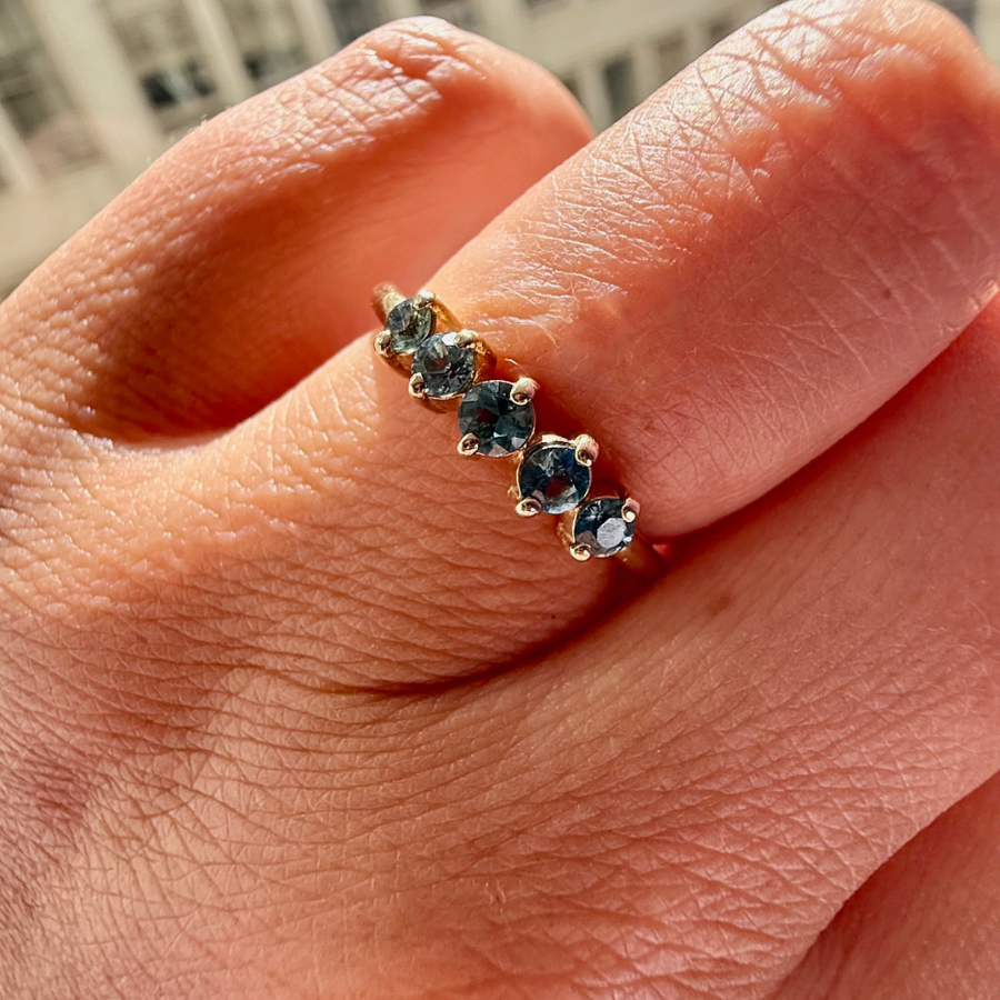 
            Blue-Green Round Brilliant Cut Sapphire Band