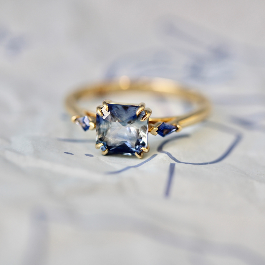 
            Blue-White Radiant Cut Sapphire Ring
