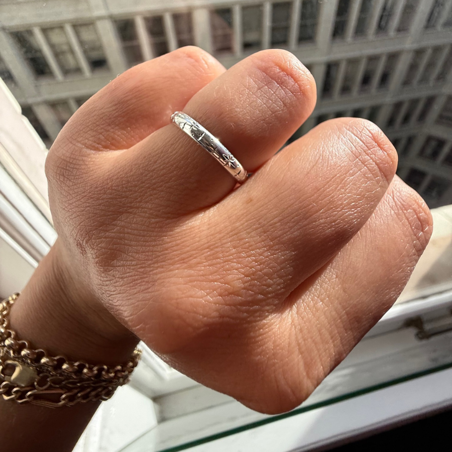 
            Celeste Major Star Engraved Sterling Silver Band