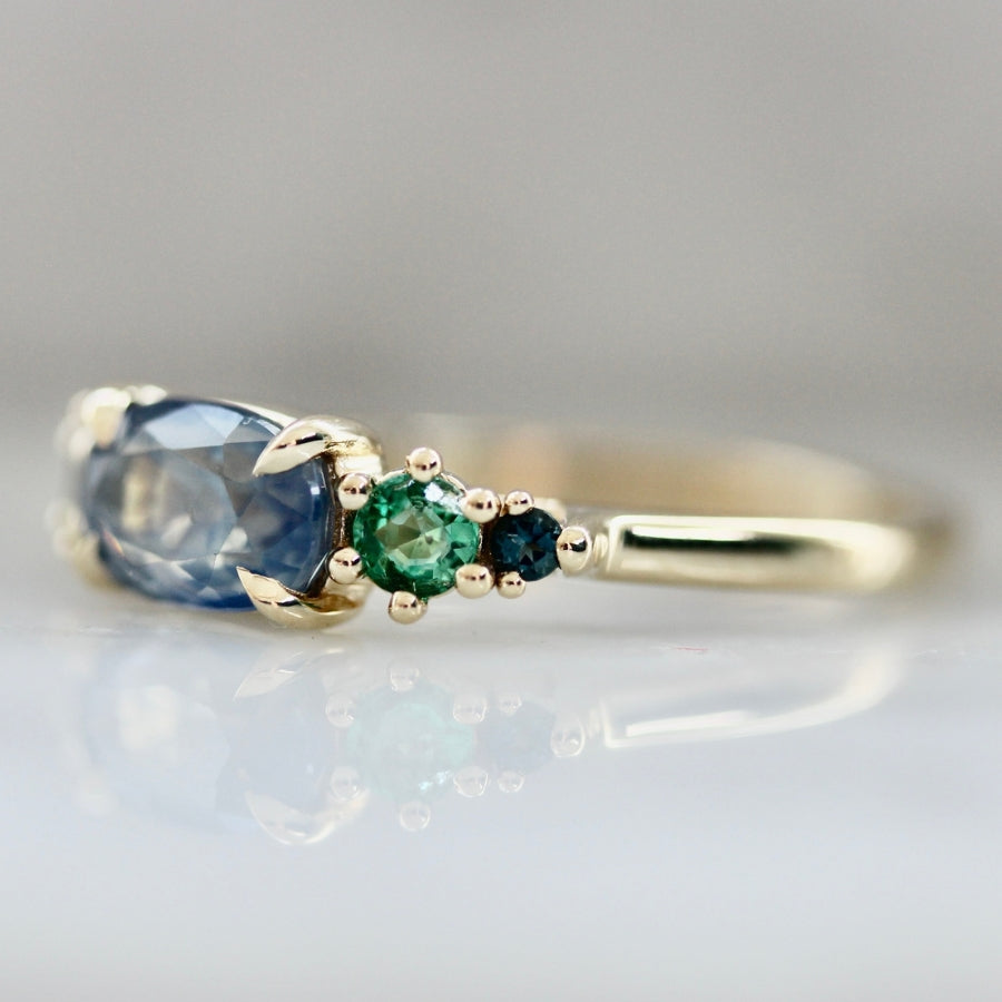 Electric Jellyfish Blue Oval Cut Opalescent Sapphire Ring