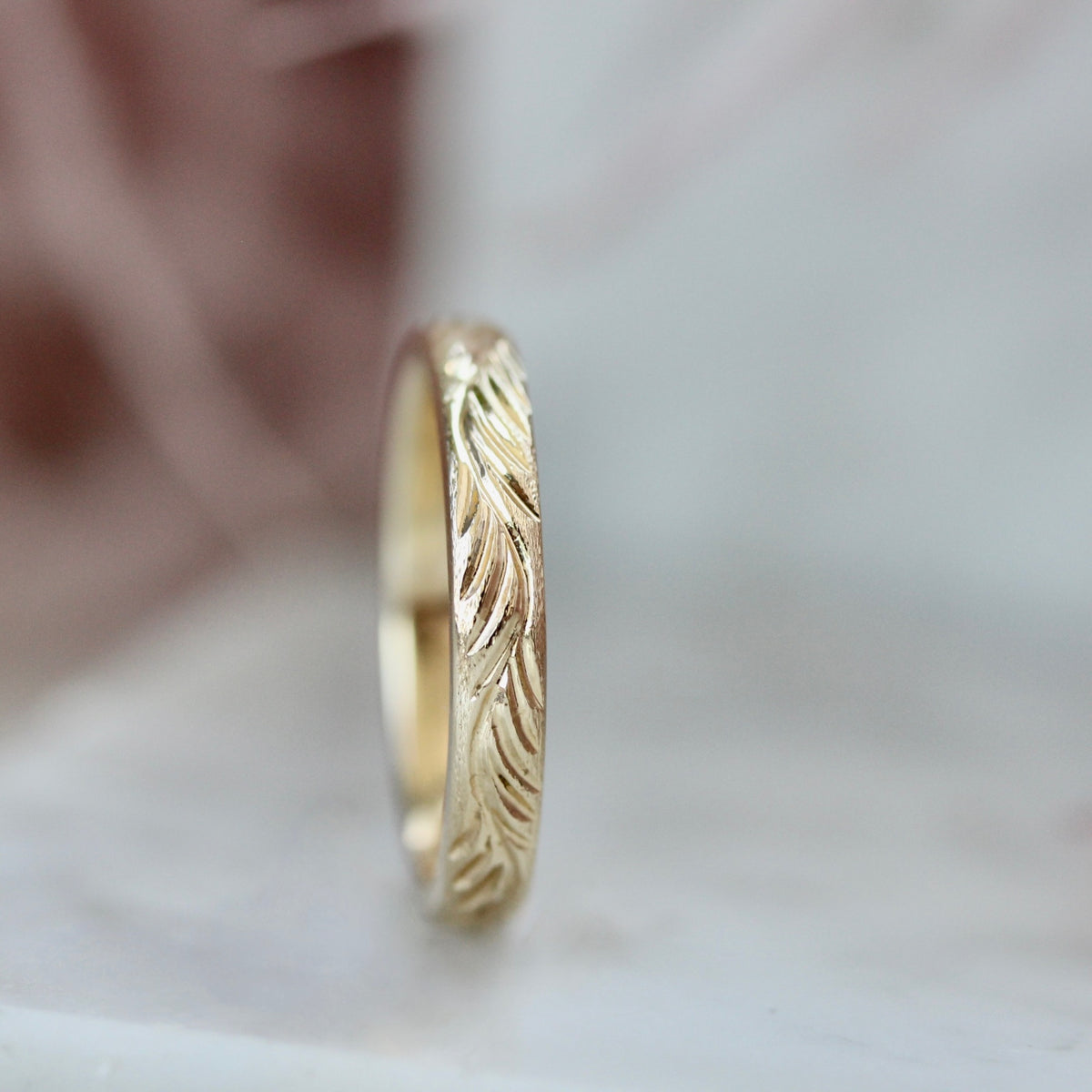 
            feather engraved wedding band