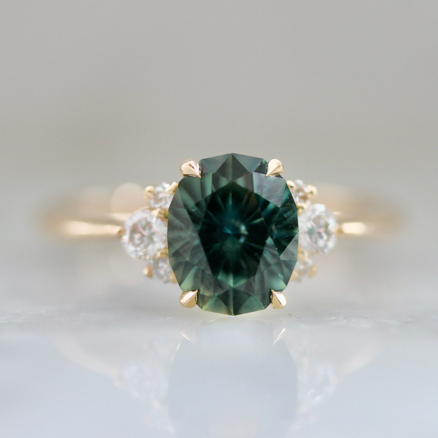 Forest green oval cut sapphire engagement ring 