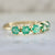 Genovia Round Brilliant Cut Emerald Band