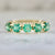 Genovia Round Brilliant Cut Emerald Band