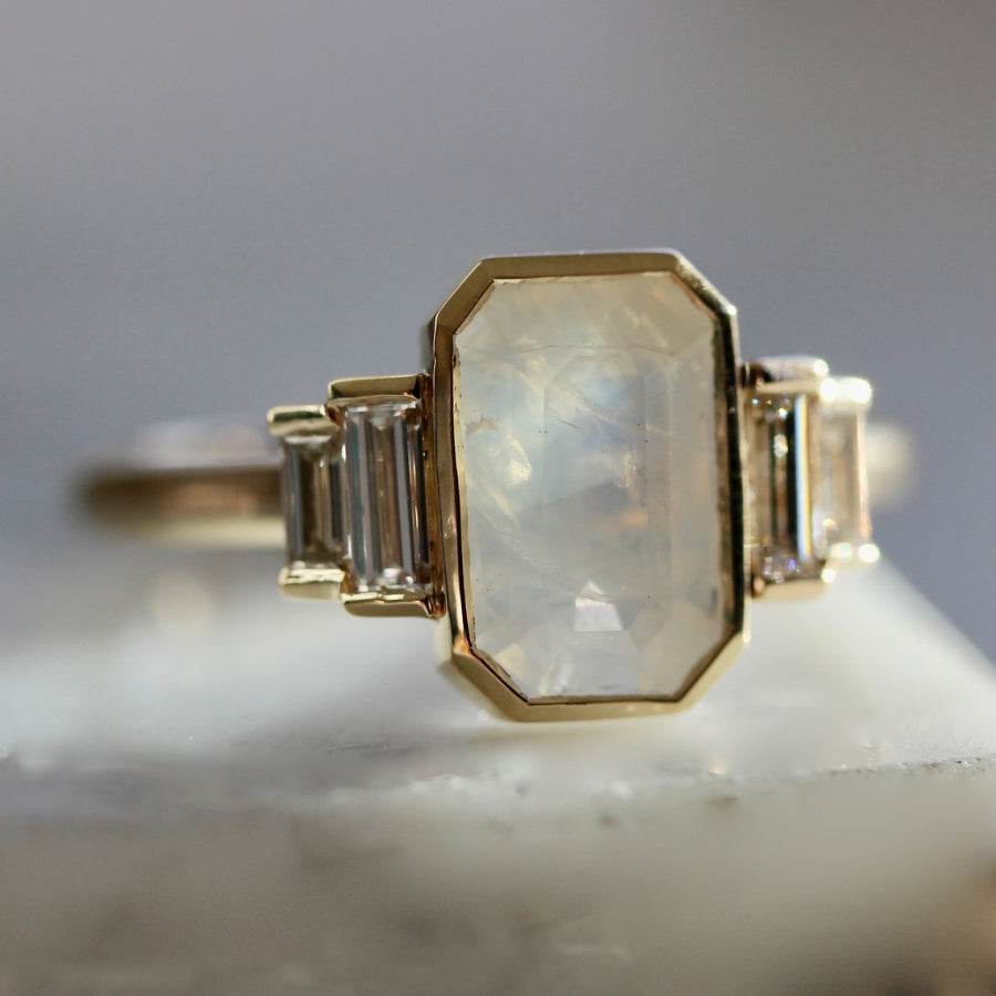 
            Ghost White Emerald Cut Opalescent Sapphire Ring