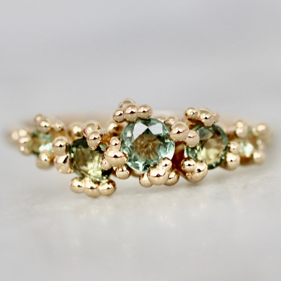 
            Green Round Cut Sapphire Cluster Ring