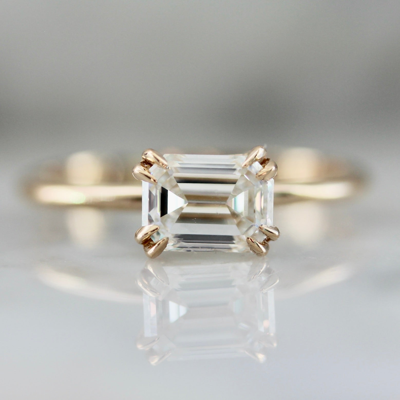 3010 - East West Emerald Cut Diamond Ring in Peach Gold 