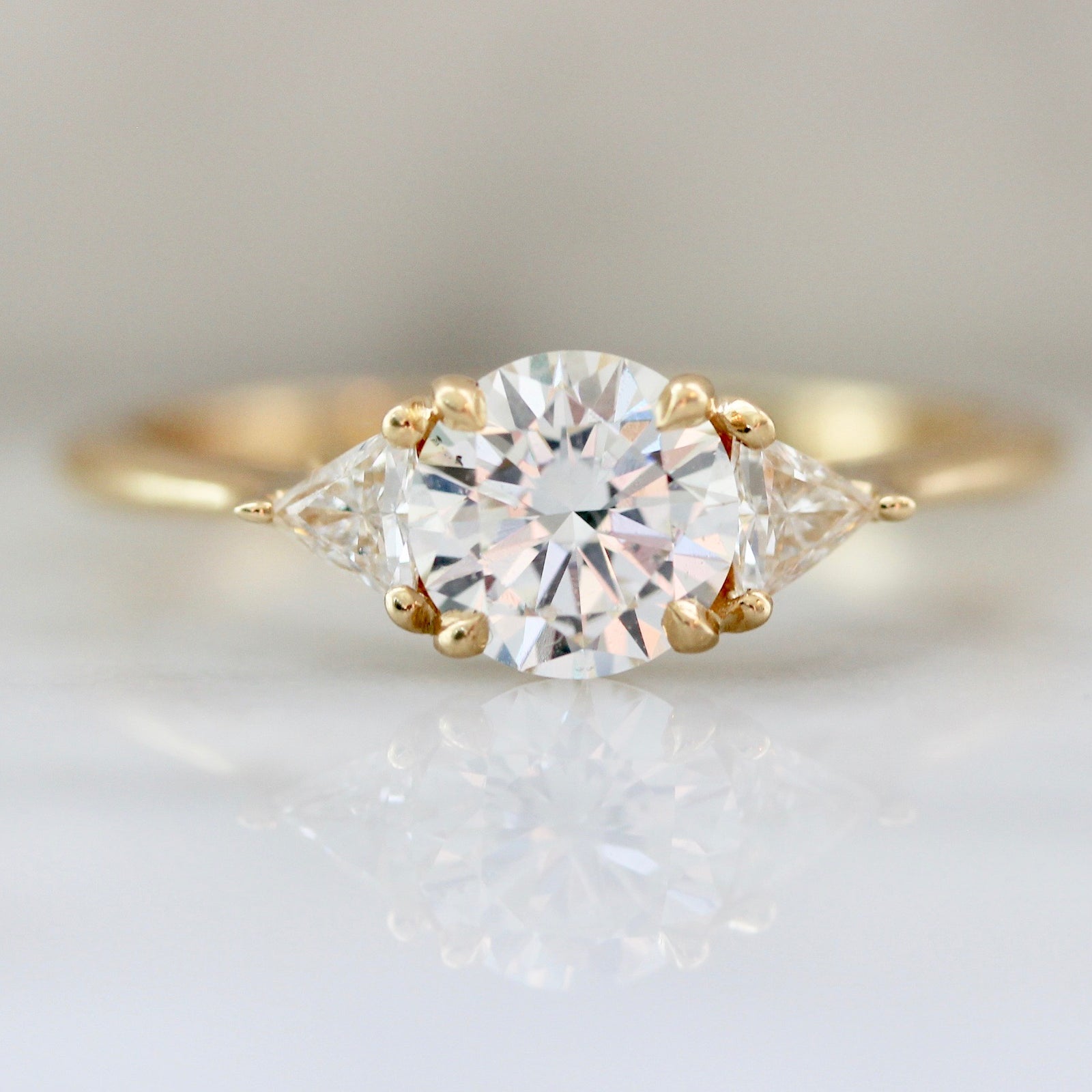 Round Cut Diamond Engagement with Trillion Cut Side Stones in 18k Yellow Gold 3083