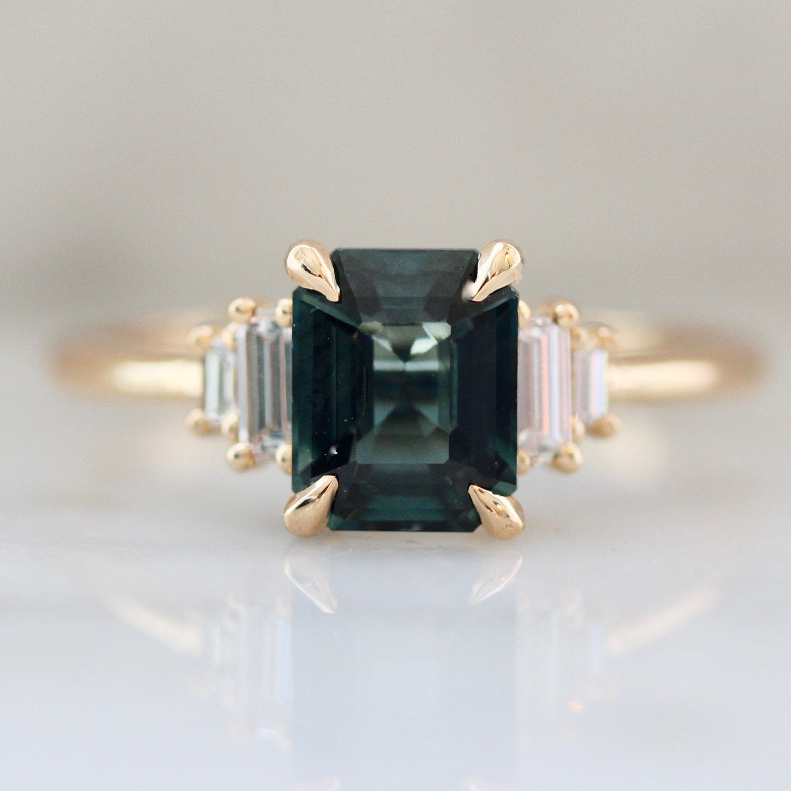 Green Emerald Cut Sapphire Ring with Baguette Cut Sides and Single Claw Prongs 3043