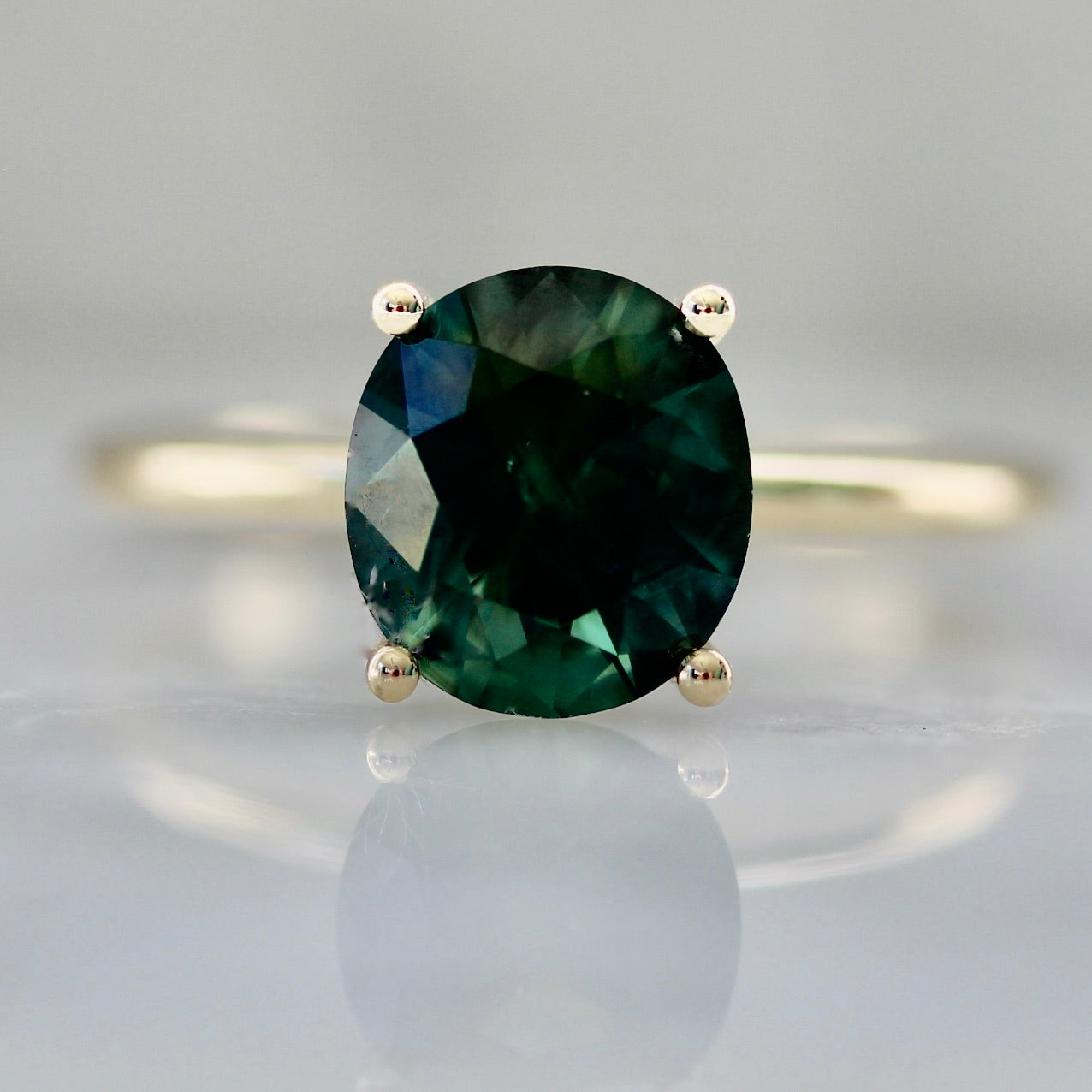 2012 - Oval Cut Green Sapphire in Yellow Gold Solitaire Setting