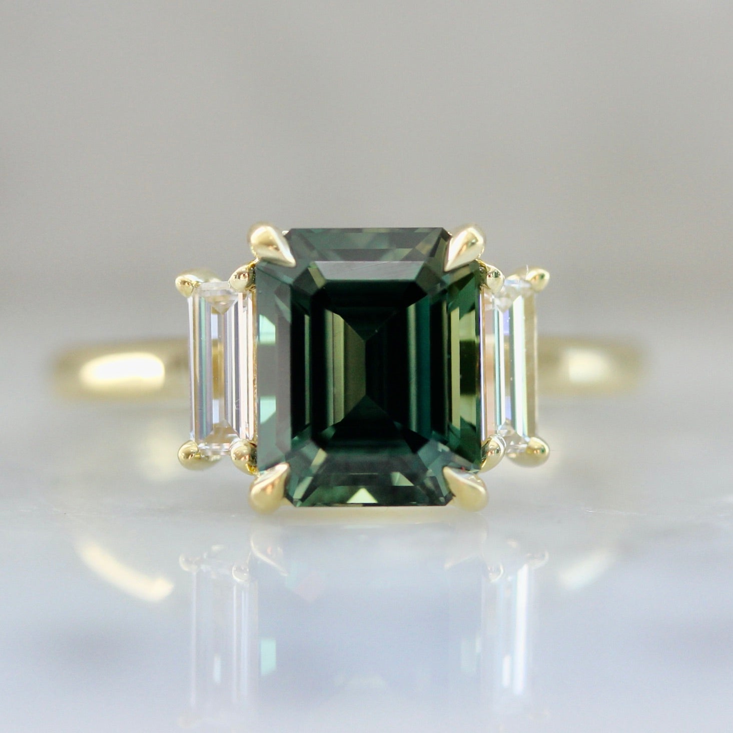 4135 Green Emerald Cut Sapphire Ring With Baguettes