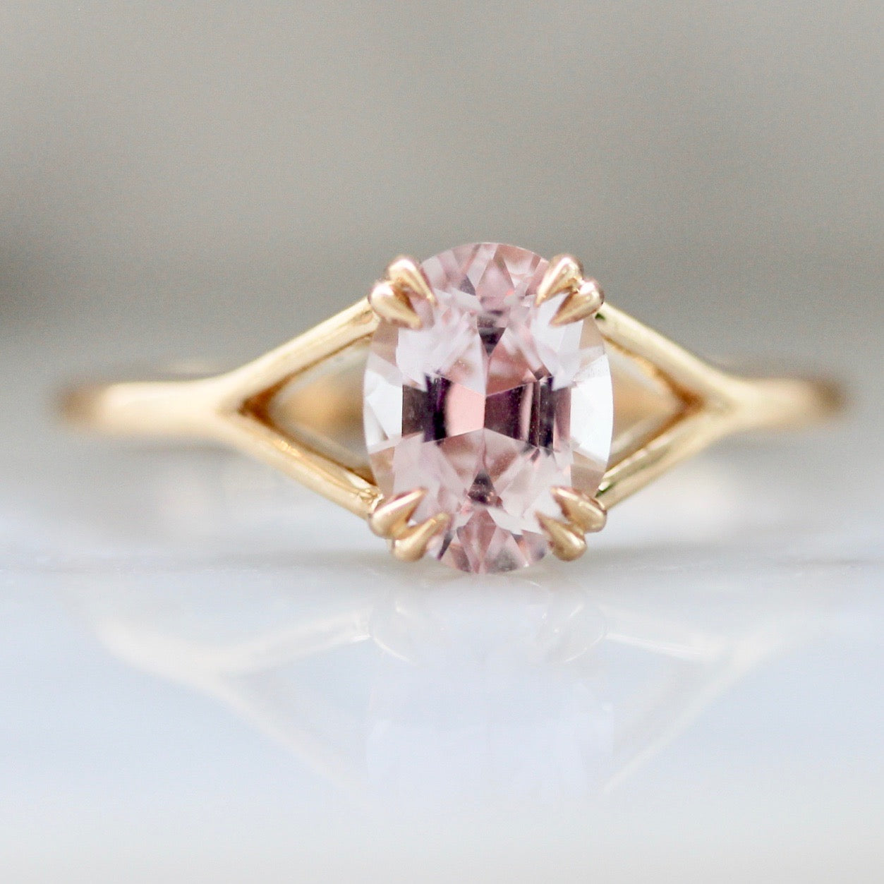 Gem Breakfast Custom Oval Cut Peach Sapphire Ring in Peach Gold with Split Shank Setting and Double Claw Prongs 2635