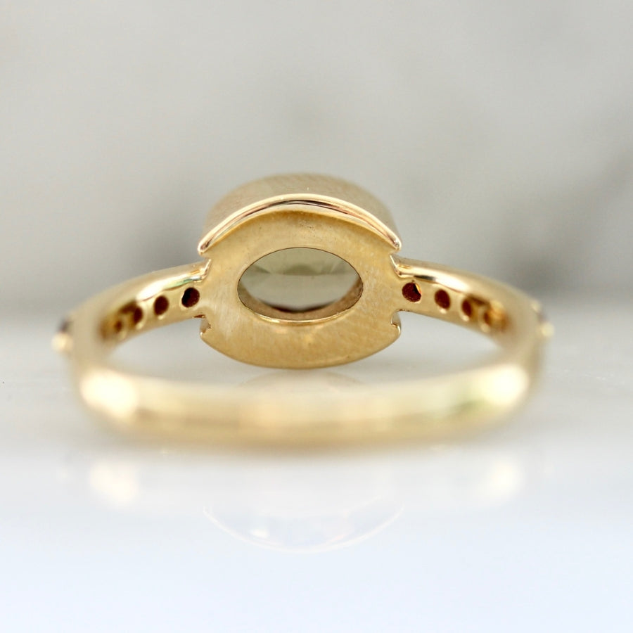 
            Mare Nubium Golden Oval Cut Sapphire Ring