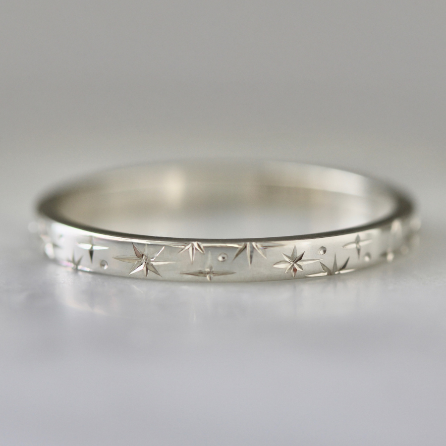 
            Orion Star Celestial Engraved Sterling Silver Band