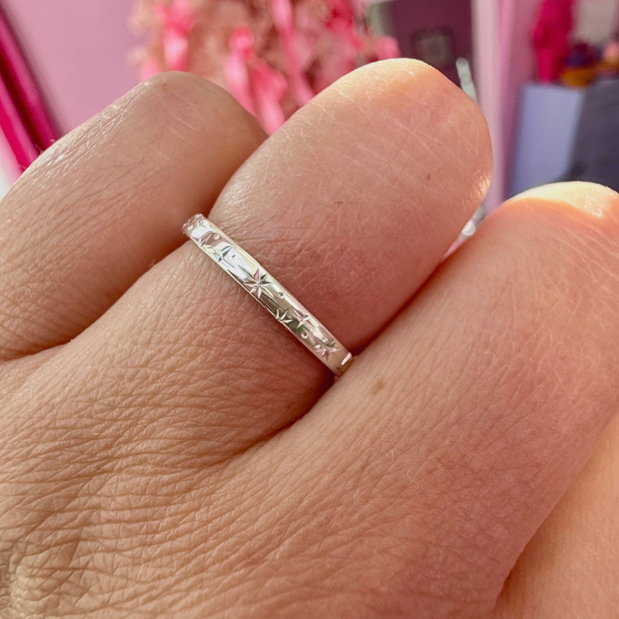 
            Orion Star Celestial Engraved Sterling Silver Band