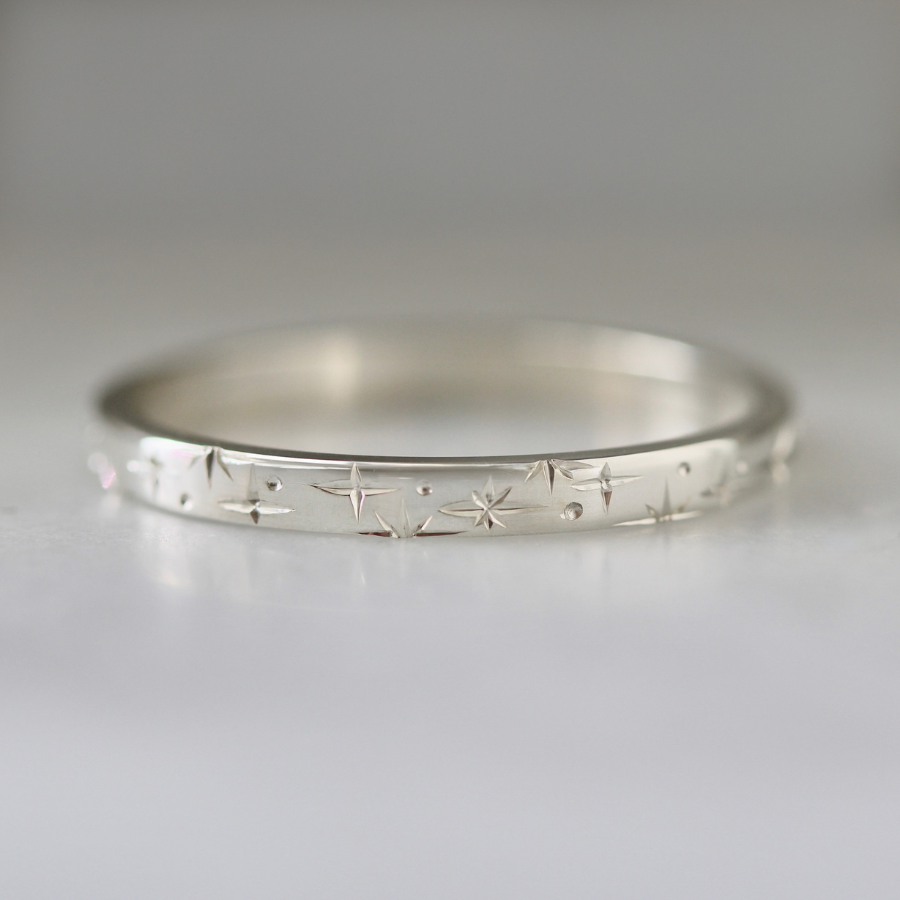 
            Orion Star Celestial Engraved Sterling Silver Band