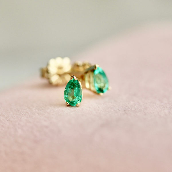 pear cut emerald earrings.