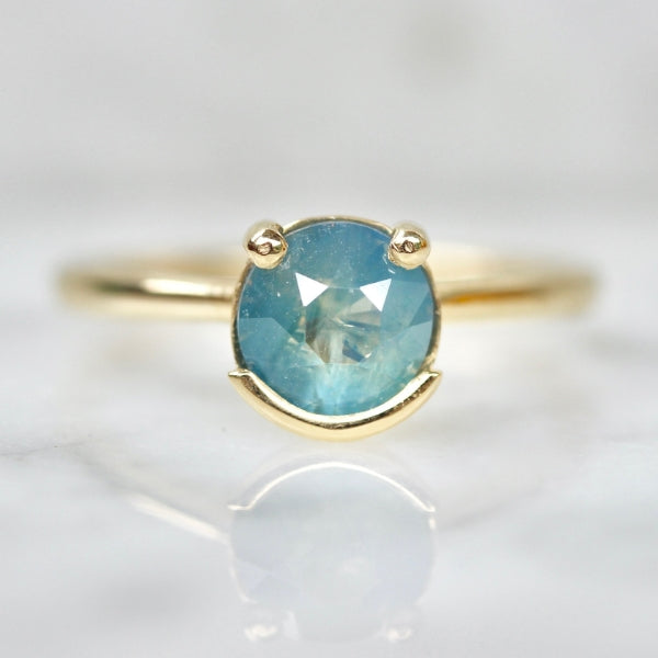 Poliwhirl Teal Round Brilliant Cut Opalescent Sapphire Ring