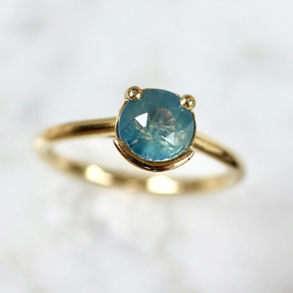 Poliwhirl Teal Round Brilliant Cut Opalescent Sapphire Ring
