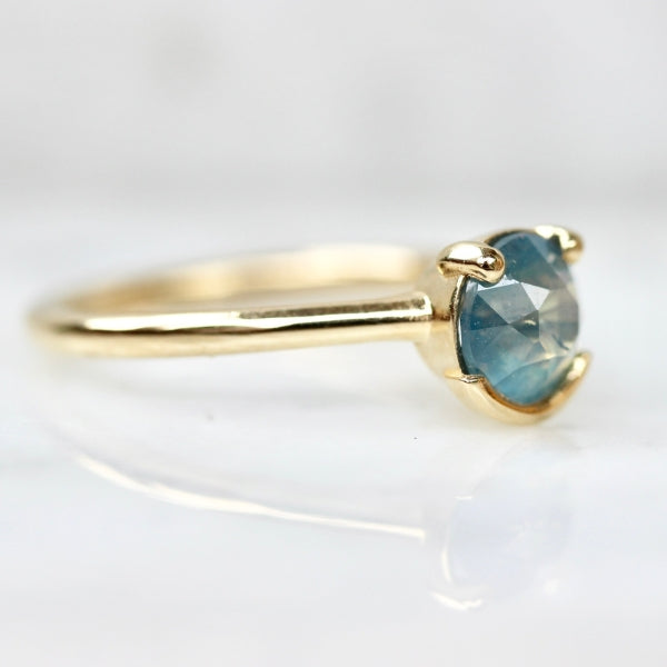 Poliwhirl Teal Round Brilliant Cut Opalescent Sapphire Ring