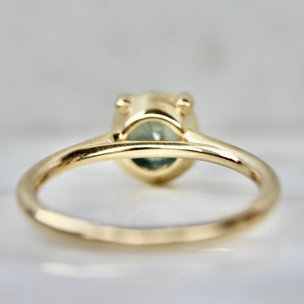 Poliwhirl Teal Round Brilliant Cut Opalescent Sapphire Ring