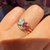 Purple-Orange Pear Cut Sapphire Ring