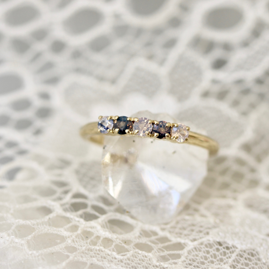 
            Round Cut Opalescent Sapphire Band