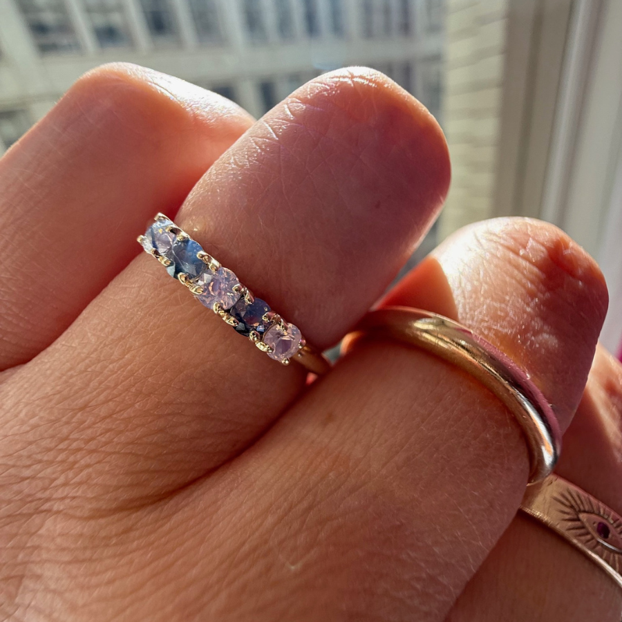 
            Round Cut Opalescent Sapphire Band