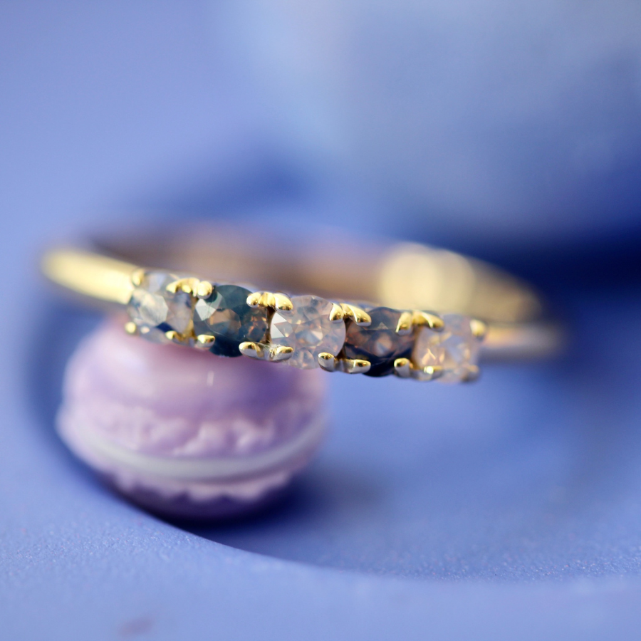 
            Round Cut Opalescent Sapphire Band