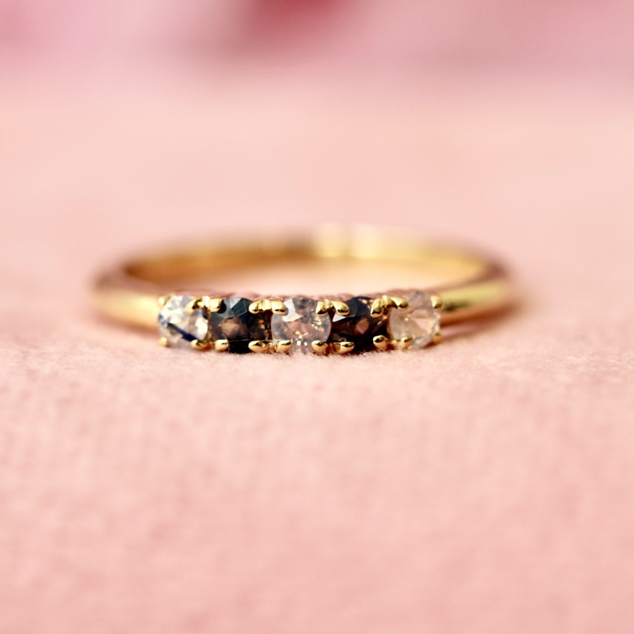 
            Round Cut Opalescent Sapphire Band