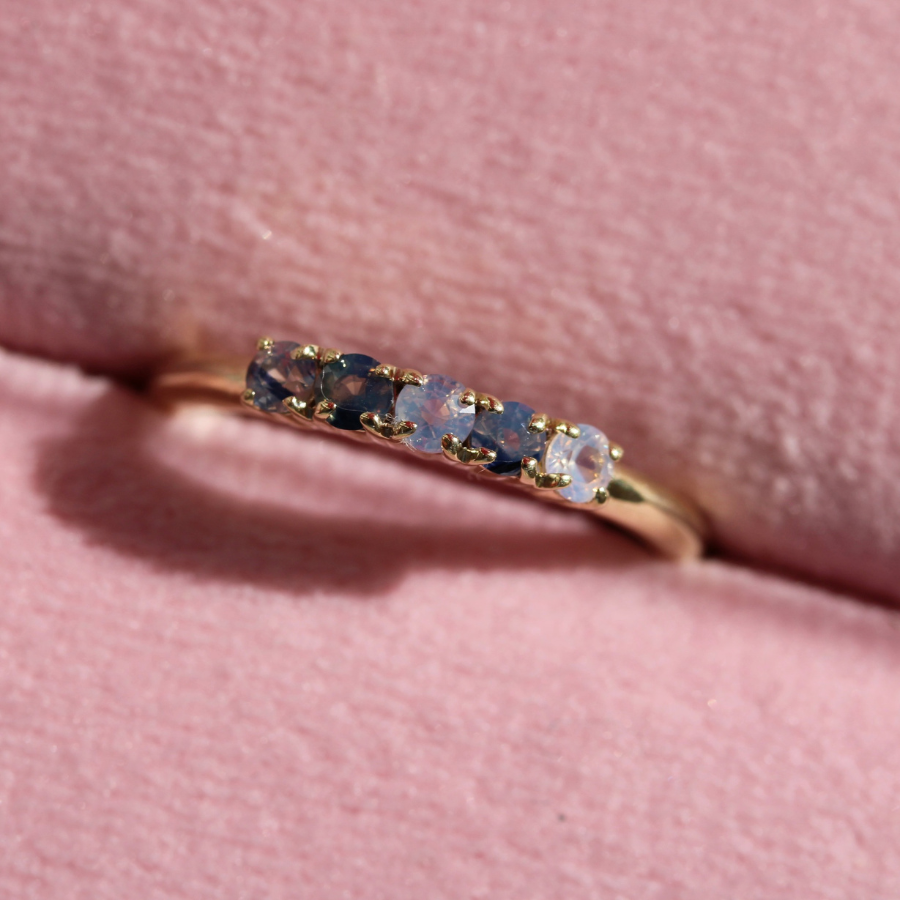 
            Round Cut Opalescent Sapphire Band