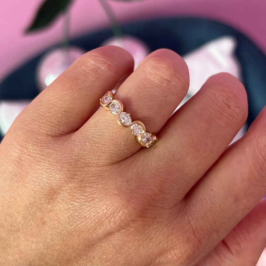
            Squiggly Oval Cut Diamond Wedding Band