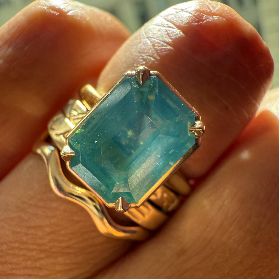 
            Teal Emerald Cut Opalescent Zircon Ring