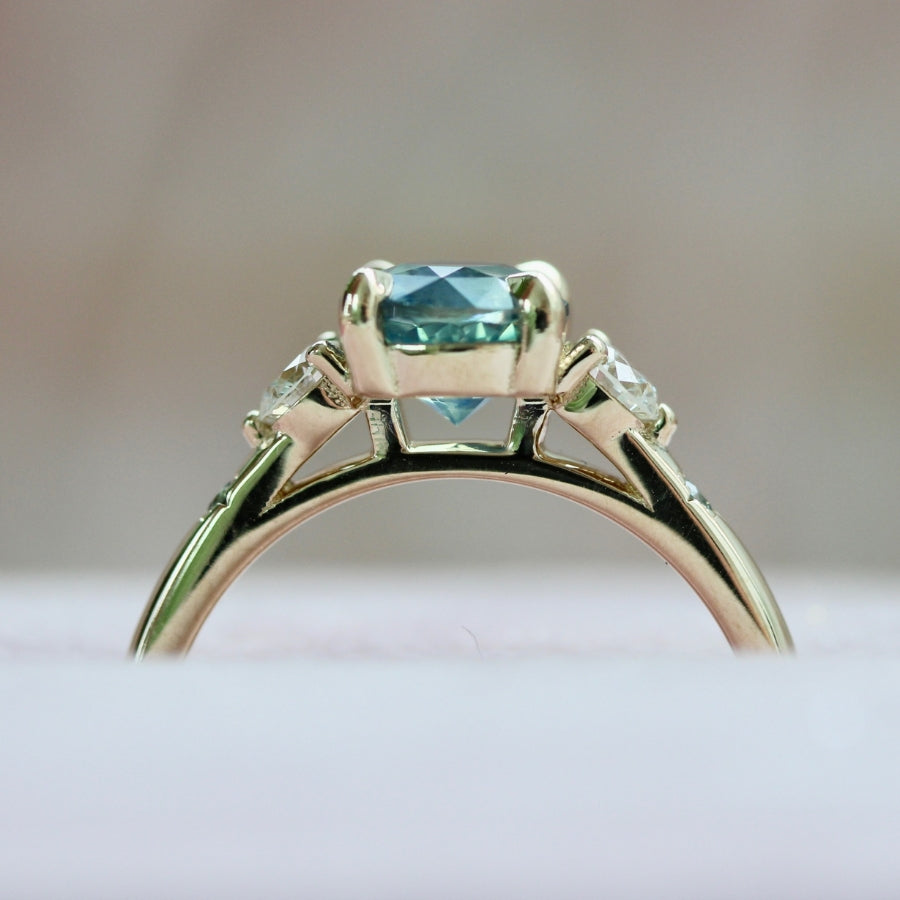 teal round brilliant cut sapphire ring