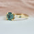 teal round brilliant cut sapphire ring