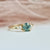 teal round brilliant cut sapphire ring