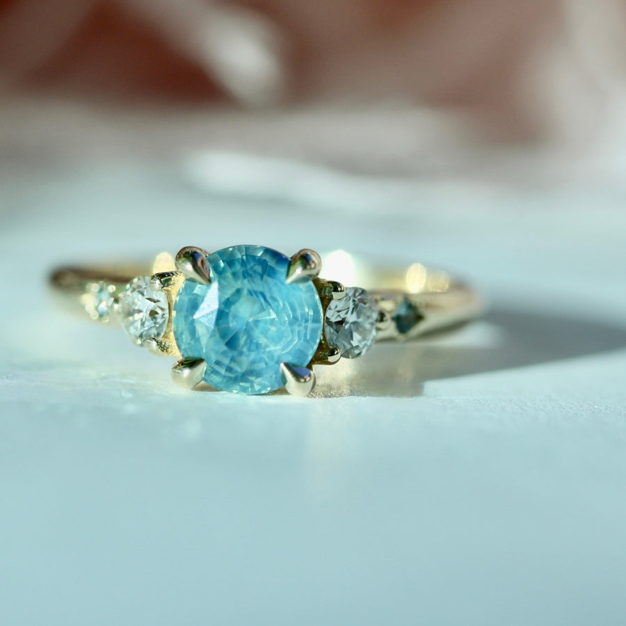 
            teal round brilliant cut sapphire ring